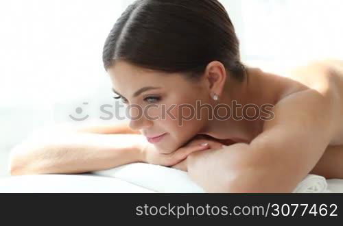 Woman smiling at spa session