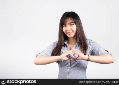 Woman smiling confidence make finger heart gesture figure symbol shape sign with two hands isolated white background, Asian happy portrait beautiful young female send love and happy valentine