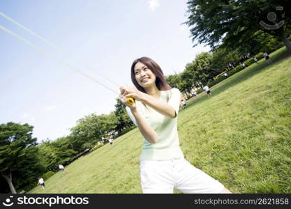 Woman smiling outside in a park