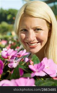 Woman Smiling Over Flowers
