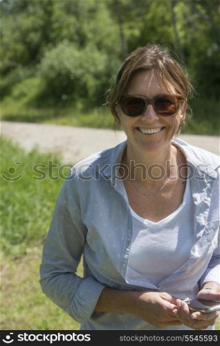 Woman smiling, Wasagaming, Riding Mountain National Park, Manitoba, Canada