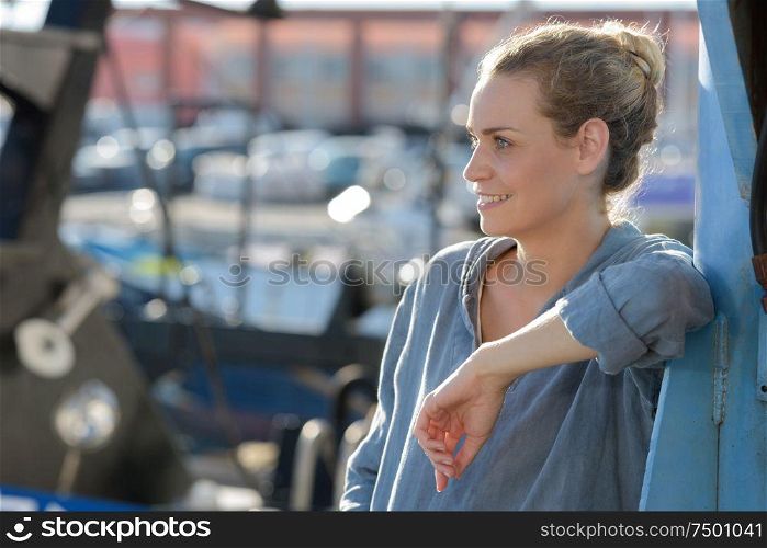 woman smiling while looking afar