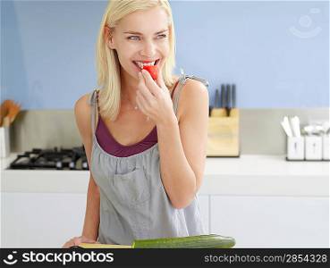 Woman Snacking in Kitchen