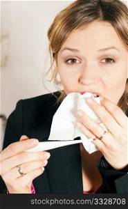 Woman sneezing, having fever, and a cold