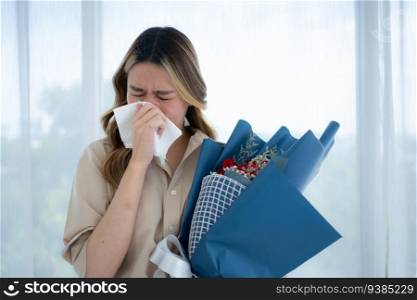 Woman sneezing in tissue due to allergy to pollen