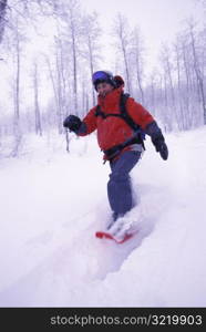 Woman Snowshoeing Fast