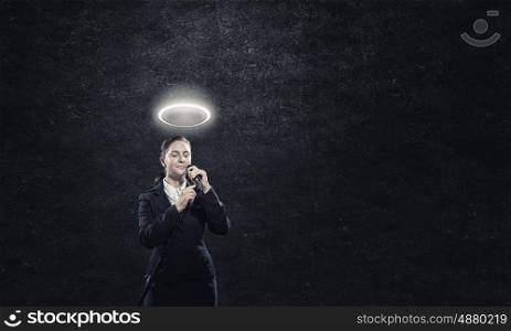 Woman speaker. Saint woman reporter with microphone gesturing with hand