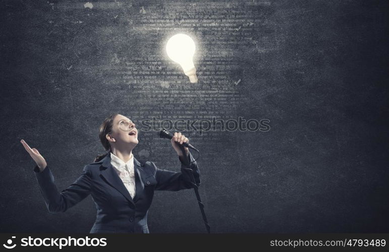 Woman speaker. Woman reporter with microphone gesturing with hand