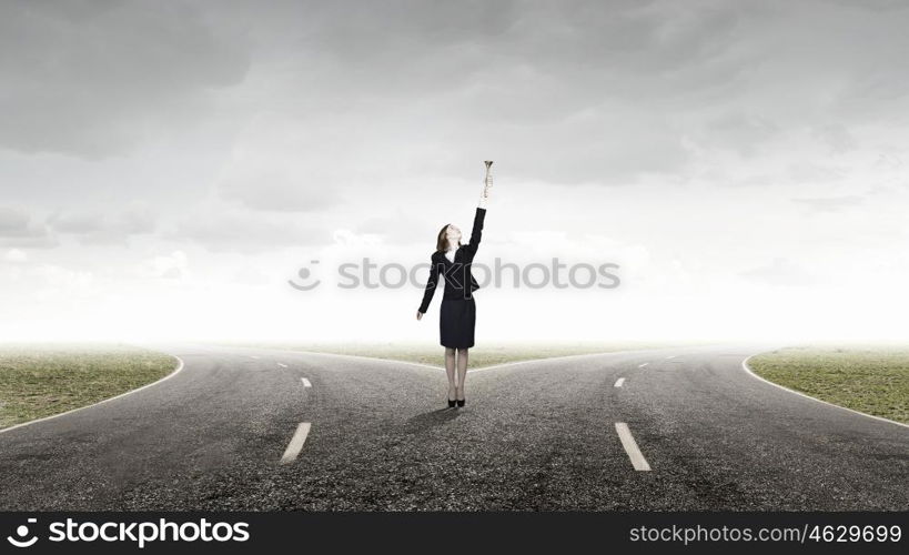 Woman speaking in horn. Young businesswoman in suit proclaiming something in horn