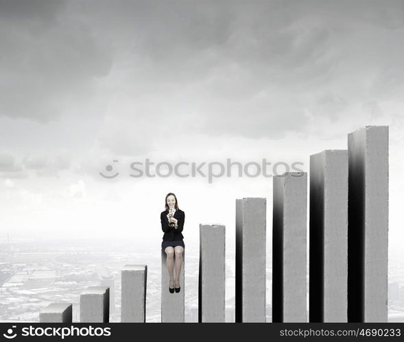 Woman speaking in horn. Young businesswoman in suit proclaiming something in horn