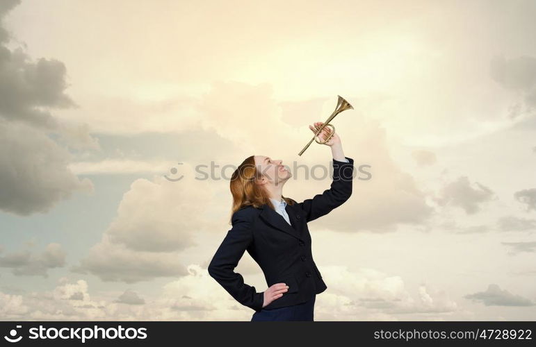 Woman speaking in horn. Young businesswoman in suit proclaiming something in horn