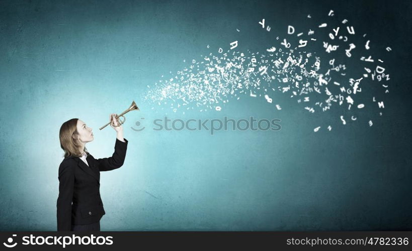 Woman speaking in horn. Young businesswoman in suit proclaiming something in horn