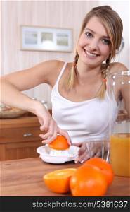 Woman squeezing orange juice