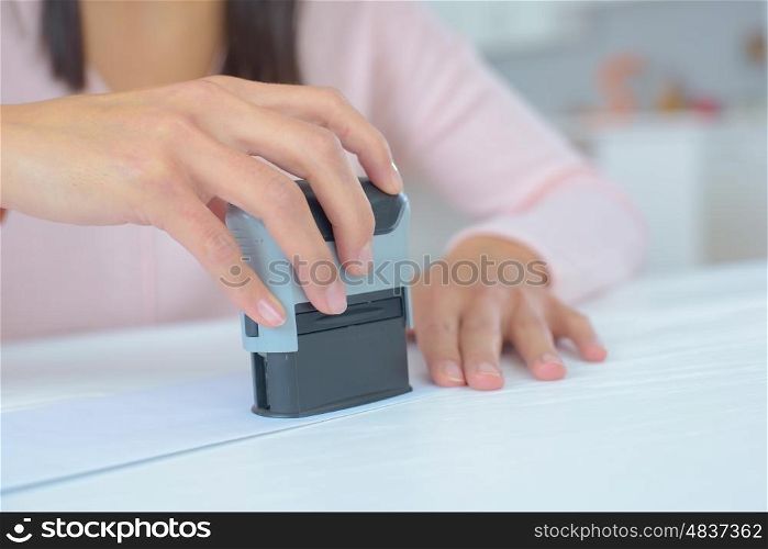 woman stamping a legal document