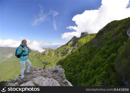 Woman stand at top of mountain