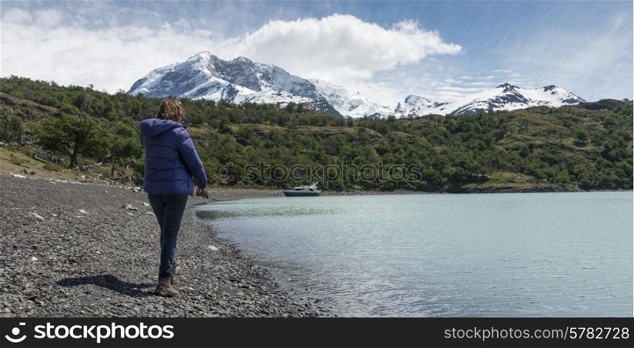 Woman standing at Lake Argentino, Santa Cruz Province, Patagonia, Argentina