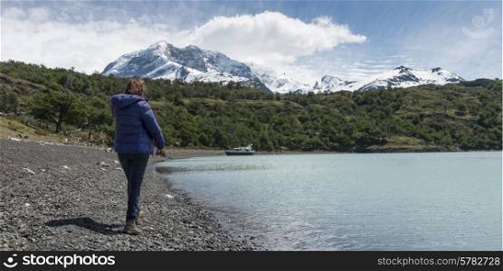 Woman standing at Lake Argentino, Santa Cruz Province, Patagonia, Argentina