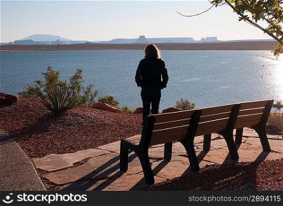 Woman standing at the lakeside, Lake Powell, Glen Canyon National Recreation Area, Arizona-Utah, USA