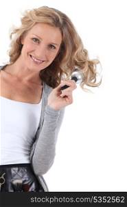 Woman standing brushing hair