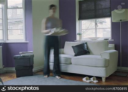 woman standing by couch