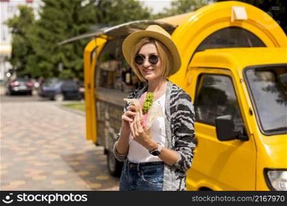 woman standing by food truck