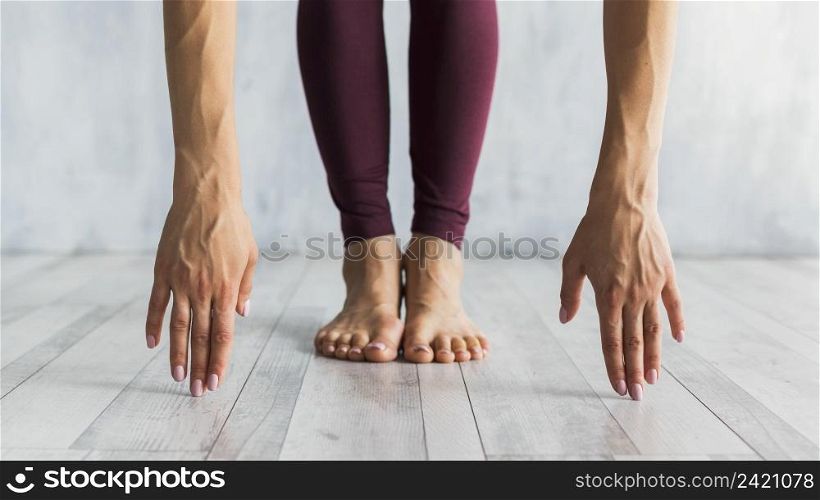woman standing forward bend pose