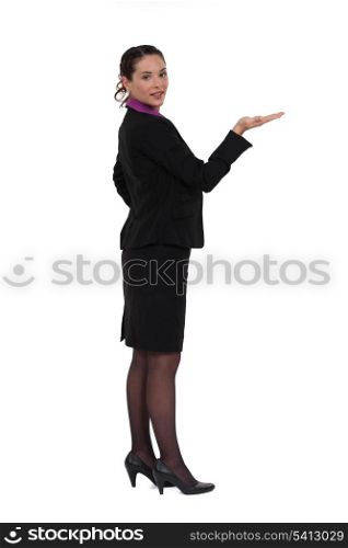Woman standing holding invisible object