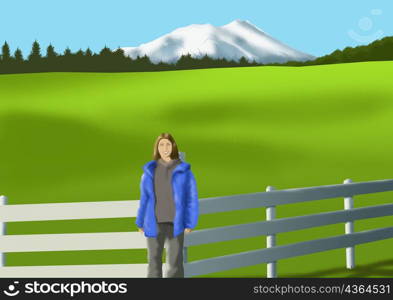 Woman standing in front of a fence