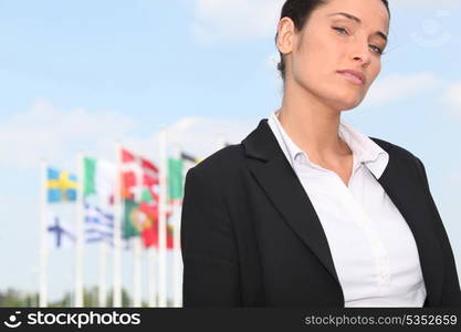 woman standing in front of European flags