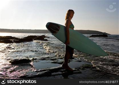 Woman standing in shallow water