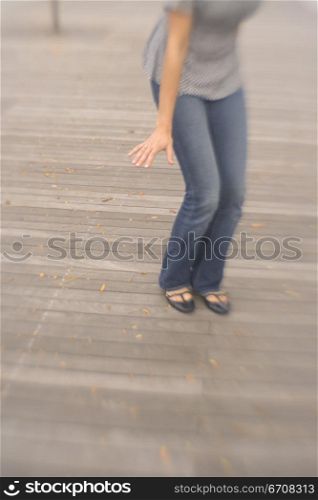 Woman standing on a floorboard