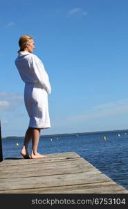 Woman standing on a jetty