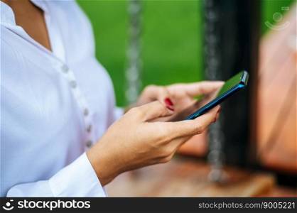 woman standing on a smartphone
