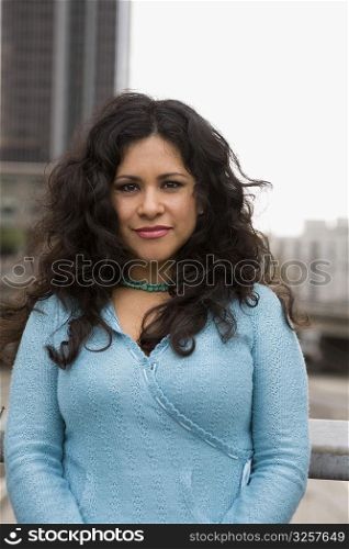 Woman standing on bridge in downtown Los Angeles