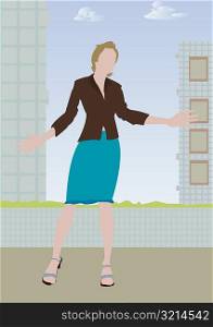 Woman standing outdoors with her arms outstretched