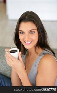 Woman starting the day with a nice cup of coffee