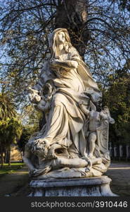 Woman statue with angels in Villa Giulia, Palermo, Italy