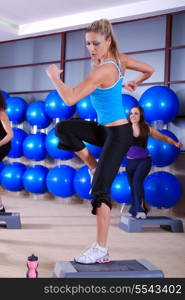 woman stepping in a fitness center