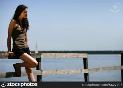 Woman stood alone on jetty