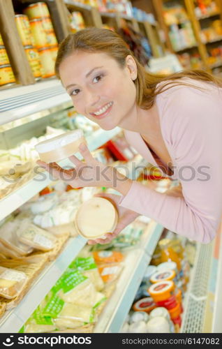 Woman stood by the cheese aisle