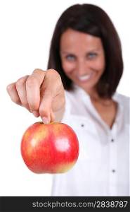Woman stood holding red apple