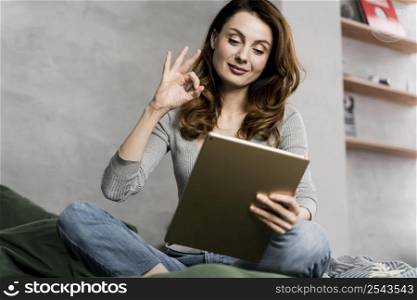 woman streaming with tablet