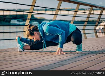 Woman streching after training outdoors