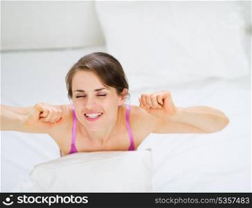 Woman stretching after awake