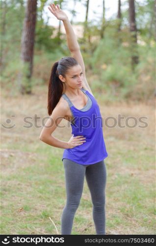 woman stretching arms before exercise