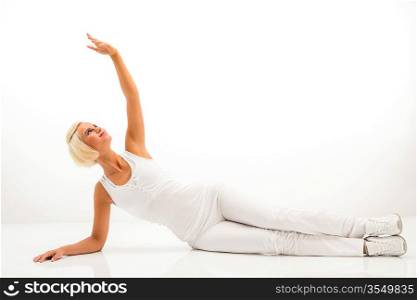 Woman stretching her arm fitness yoga exercise workout white background