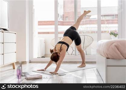 woman stretching yoga mat