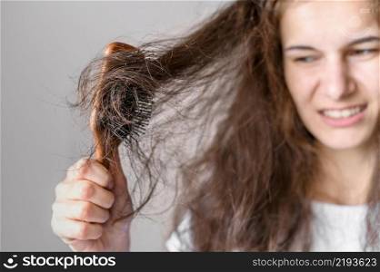 woman struggling brush hair