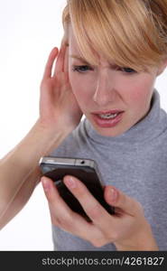 Woman struggling to hear her phone