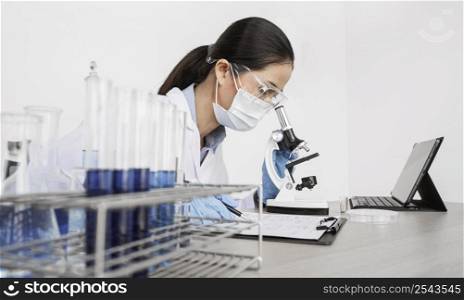 woman studying chemical elements indoors